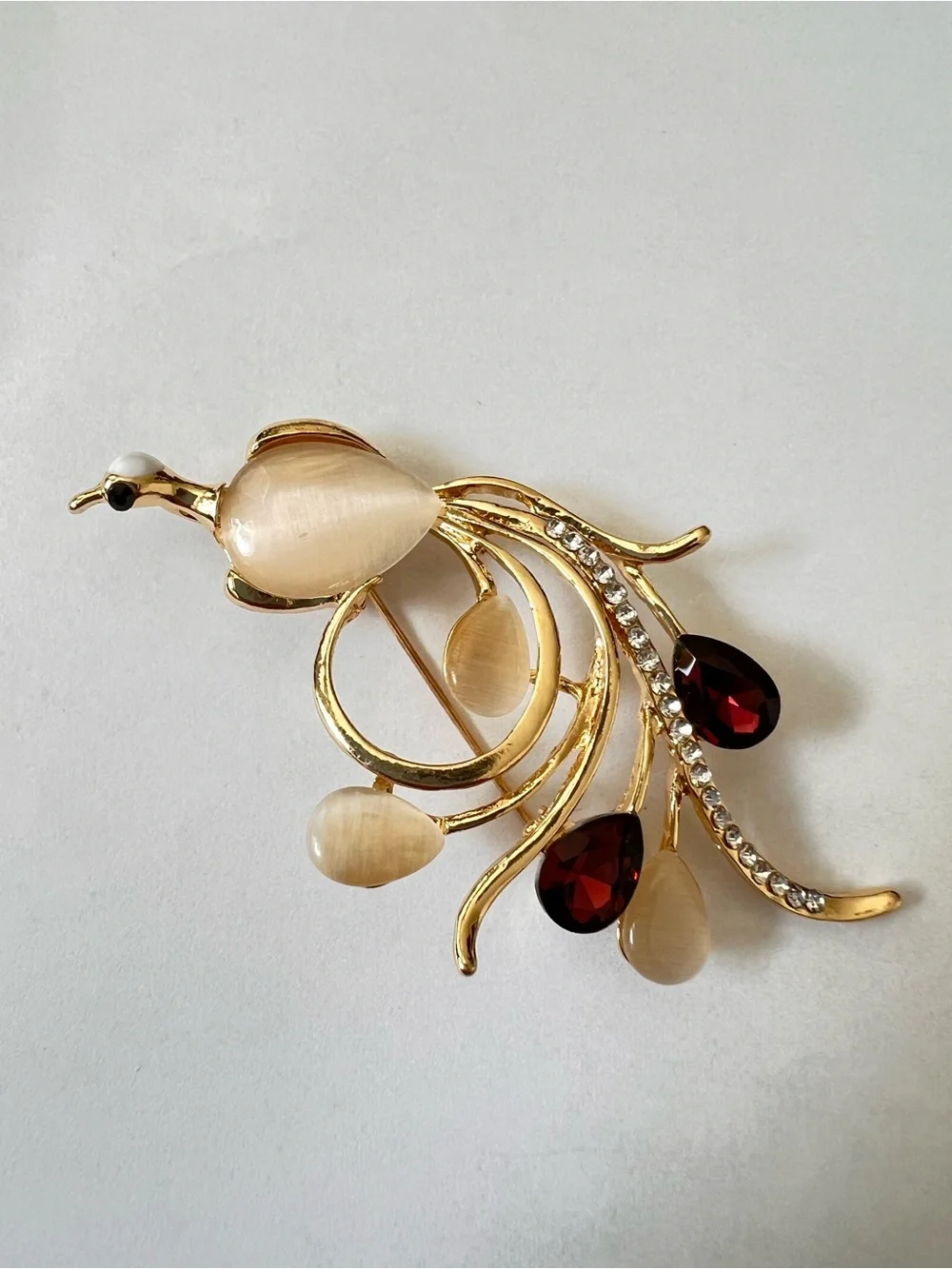 Gold-Tone Floral Bird Brooch with Champagne and Garnet Stones